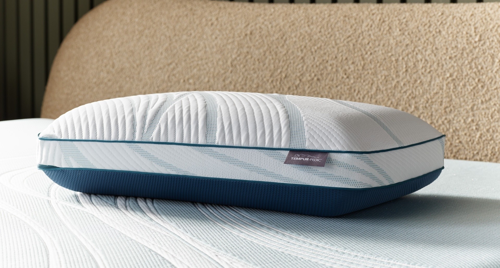 A Tempur Adapt Pro Hi Pillow laying on a Tempur Pedic mattress